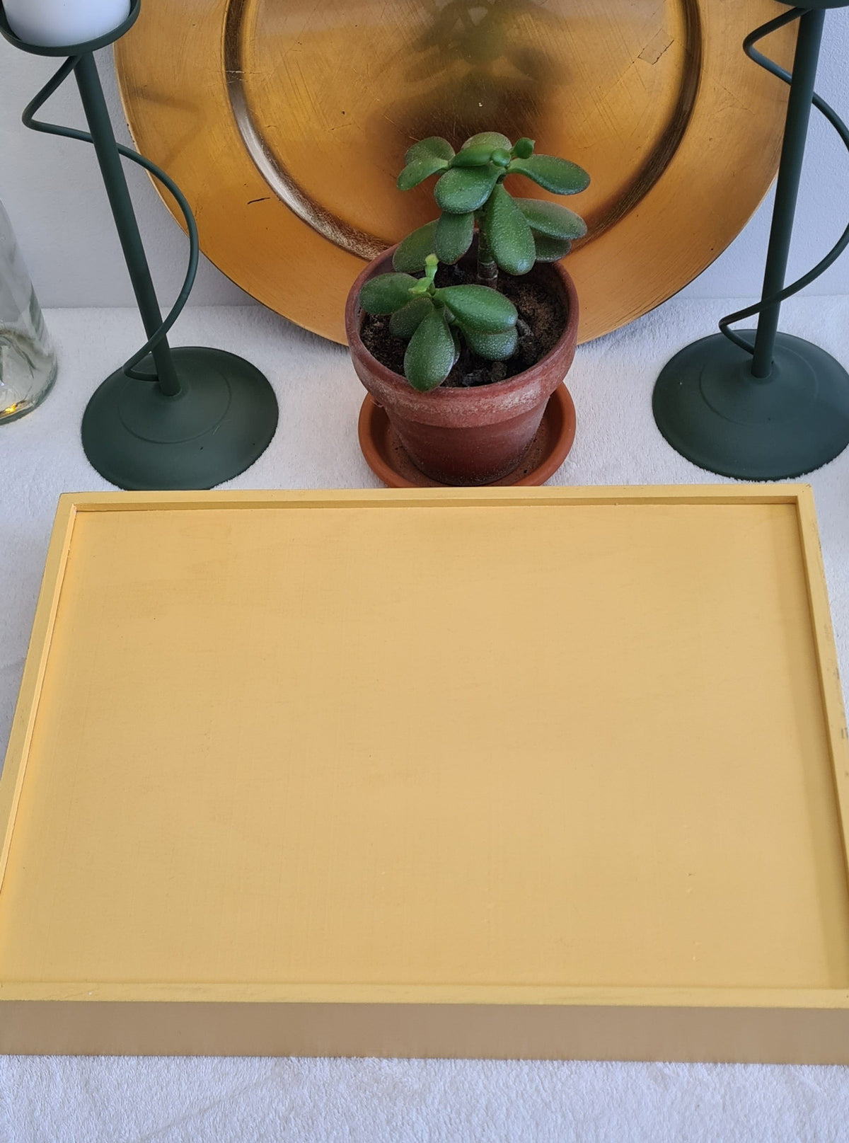 Reverse side of serving tray showing mustard yellow finish.