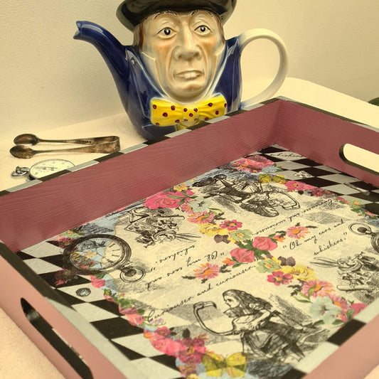 Handcrafted pink Alice in Wonderland wooden serving tray with integrated handles and harlequin edging.