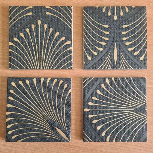 Set of four handmade Art Deco Fan ceramic coasters with bronze metallic edging.