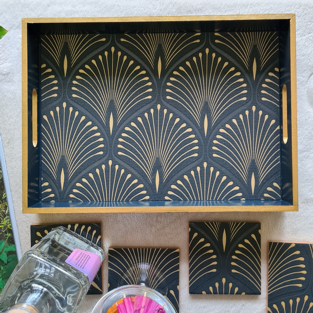Geometric Art Deco fan design on a handcrafted deep blue wooden serving tray with bronze edging. Matching coasters available separately.