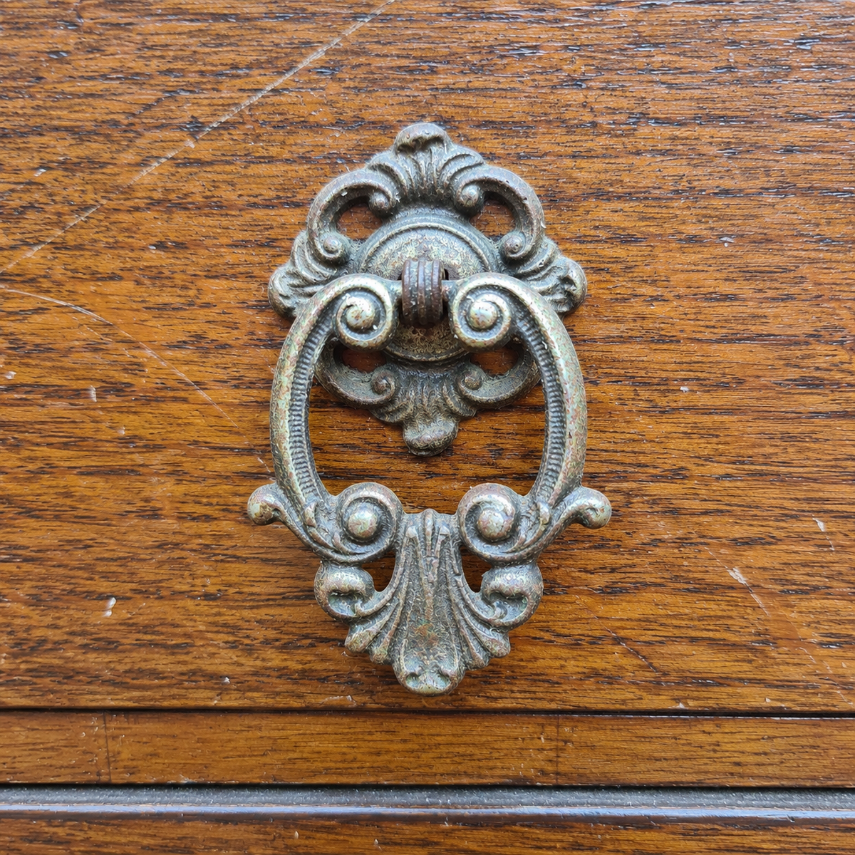 Ornate original drop hand on vintage Beeanese mid-century five-drawer tallboy chest ready for a bespoke furniture transformation.