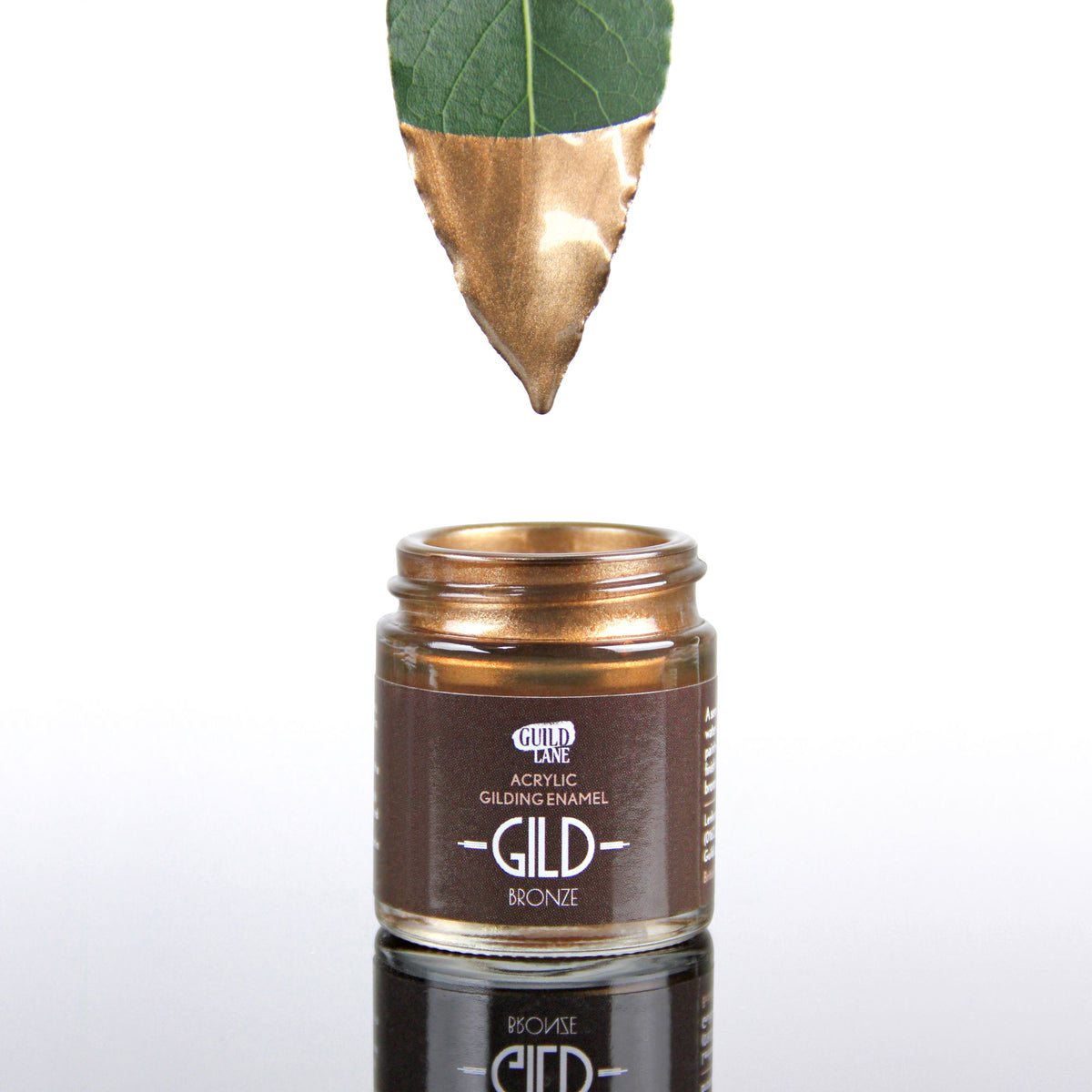 A jar of Guild Lane GILD Originals Bronze metallic enamel paint with warm earthy tones and subtle golden highlights.