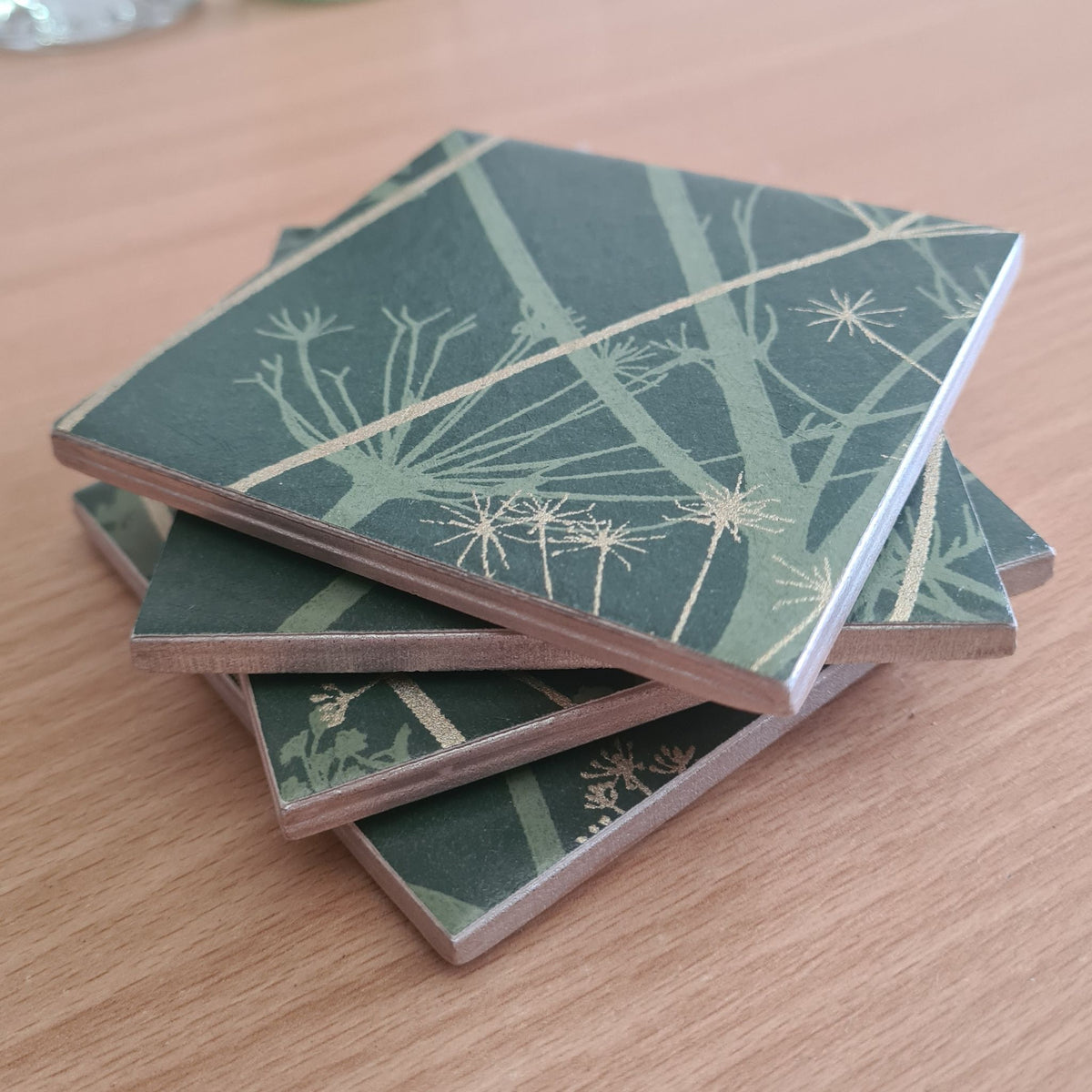 stacked set showing handcrafted finish on a Wild Chervil ceramic coaster in Sage and Gold.