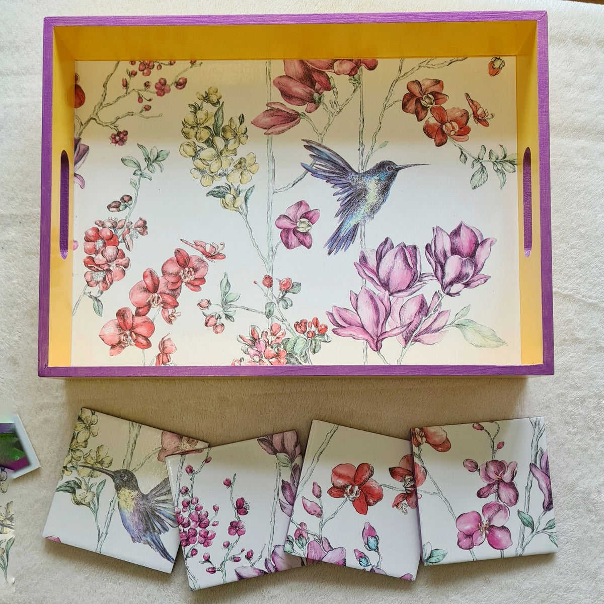 Set of four handmade Hummingbird Floral serving tray with matching ceramic coasters showing metallic violet edging.