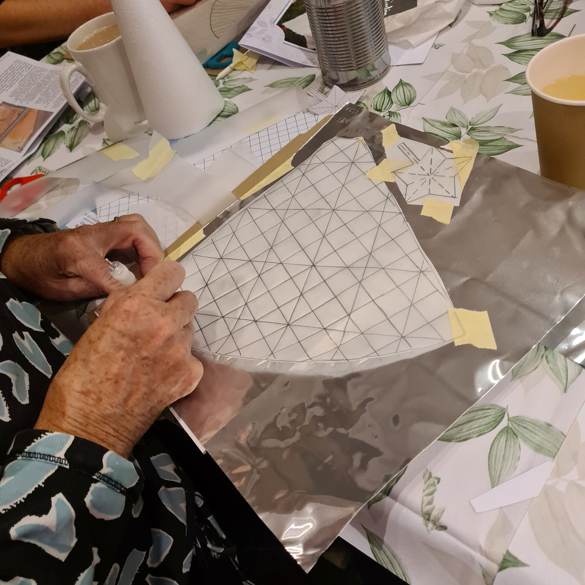 Metal embossing kit being used by a beginner.