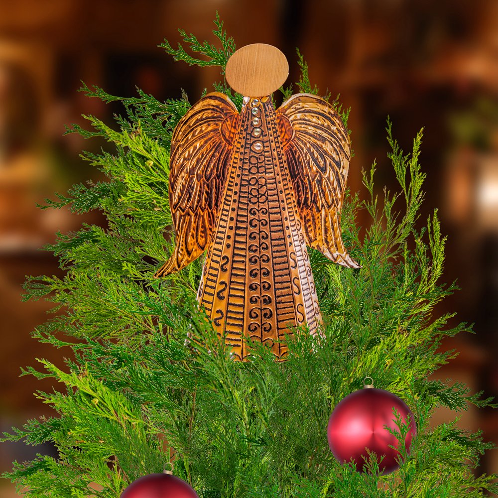 Copper Angel Christmas decoration created with a beginner-friendly metal embossing craft kit, displayed on a Christmas tree.