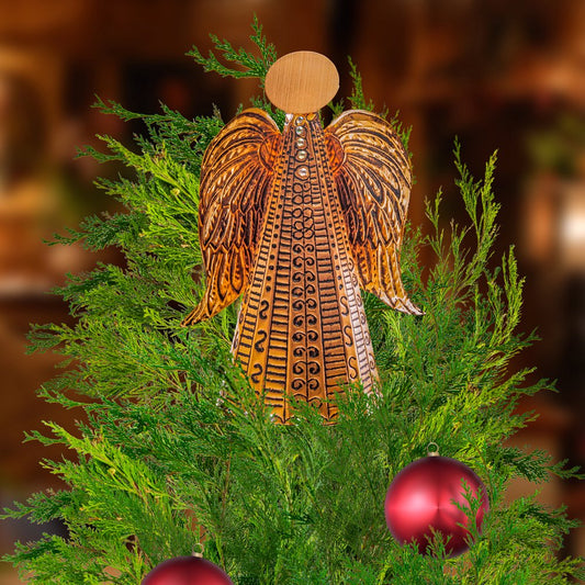 Copper Angel Christmas decoration created with a beginner-friendly metal embossing craft kit, displayed on a Christmas tree.