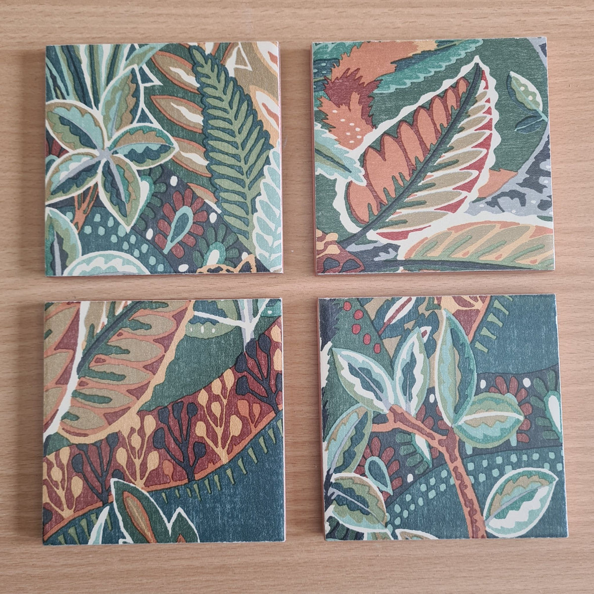 One-of-a-kind set of four ceramic coasters handmade using Nature's Exhibitionists wallpaper.