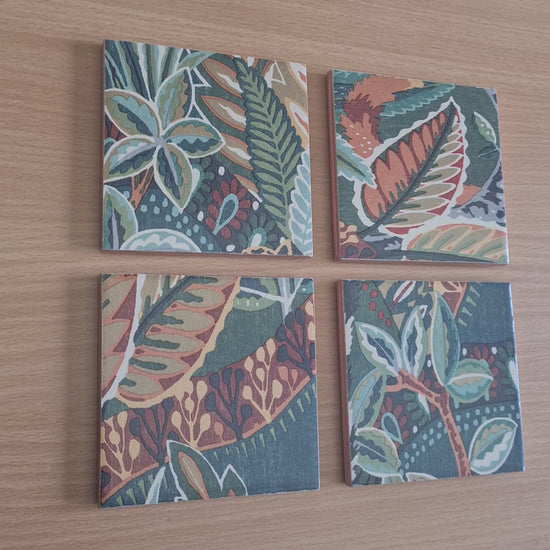 Video of one-of-a-kind set of four handmade Nature's Exhibitionists ceramic coasters showing the colourful wildlife and maximalist botanical design.

