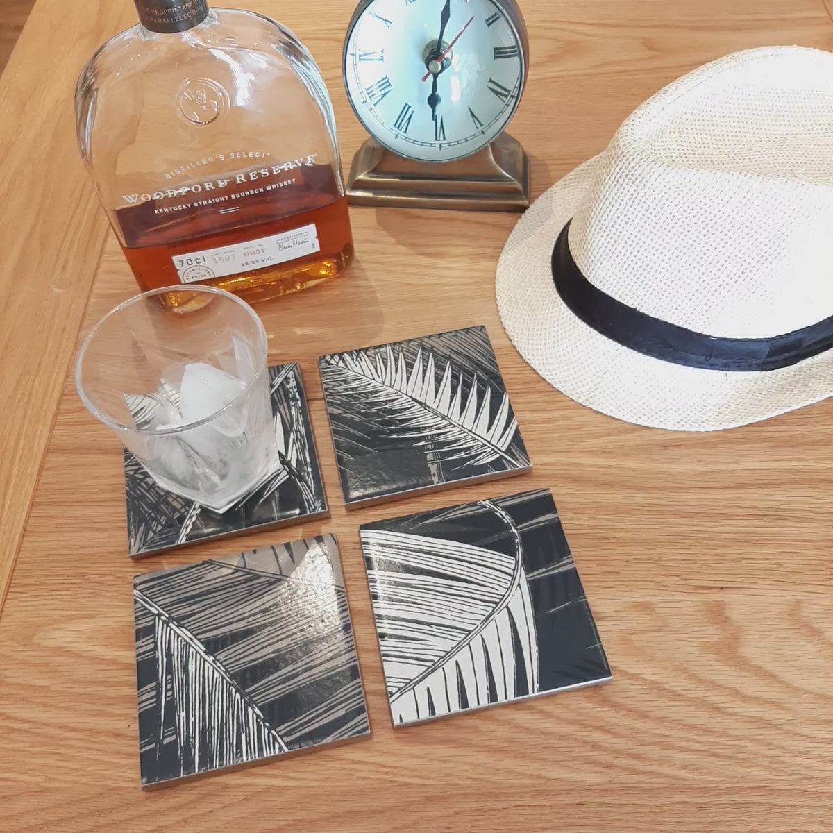Video showing one-of-a-kind set of four ceramic coasters handmade using Cole & Son Palm Jungle wallpaper.