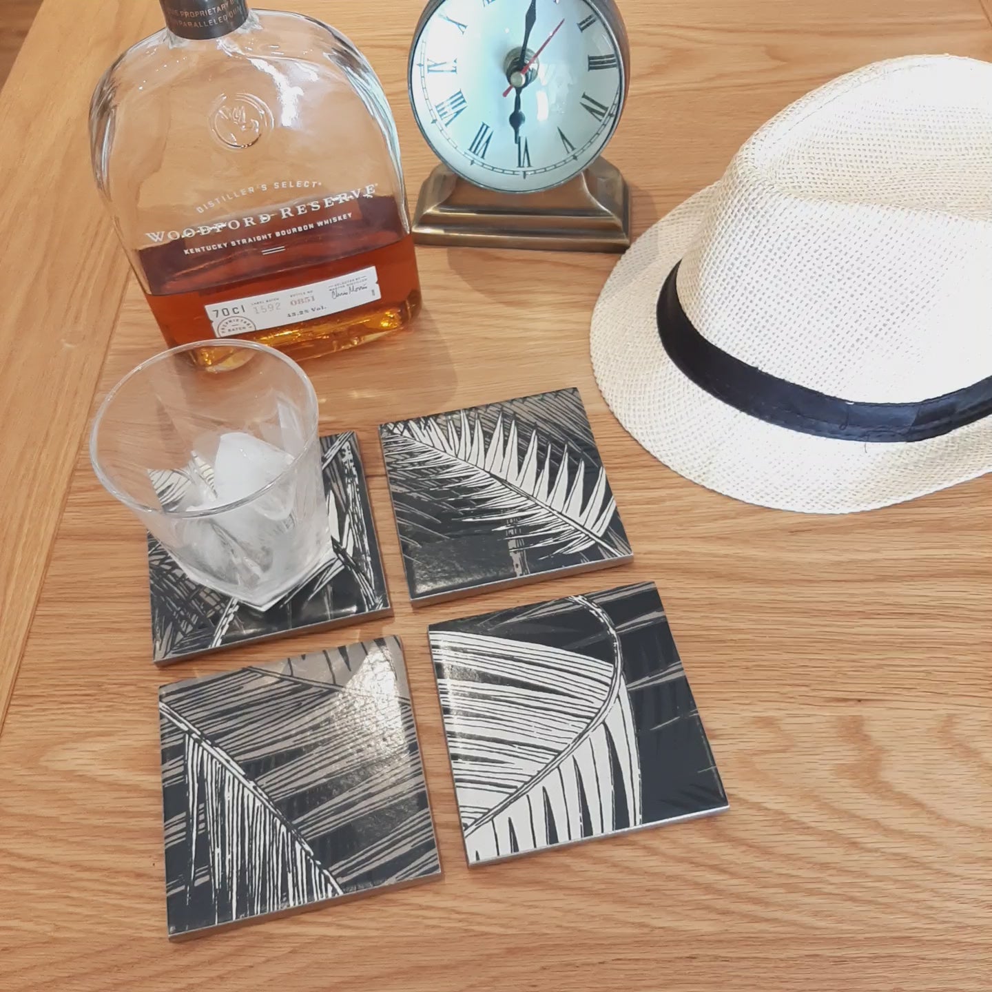 Video showing one-of-a-kind set of four ceramic coasters handmade using Cole & Son Palm Jungle wallpaper.