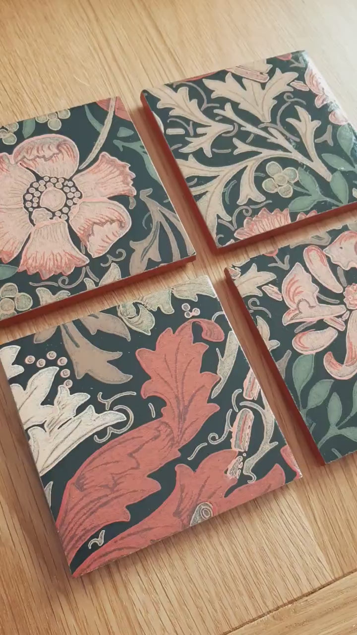 Video of set of four handmade William Morris Compton ceramic coasters showing the intricate botanical design, hand-finished metallic edging and handcrafted finish.