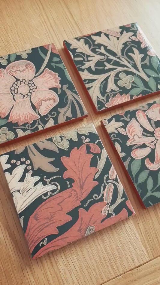Video of set of four handmade William Morris Compton ceramic coasters showing the intricate botanical design, hand-finished metallic edging and handcrafted finish.