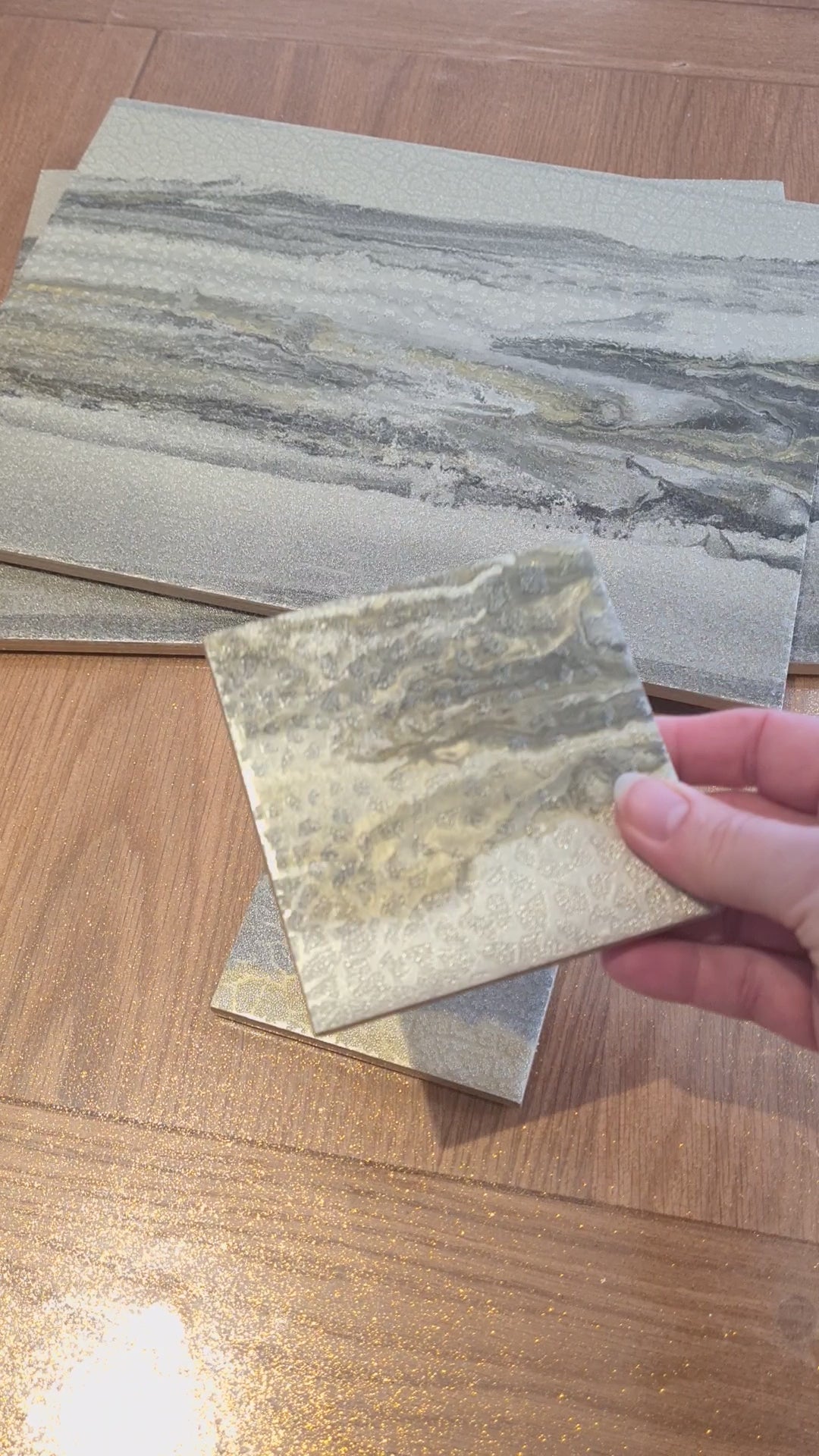 Video showing ceramic placemats and coasters created from customer's wallpaper by The Furniture Bureau.