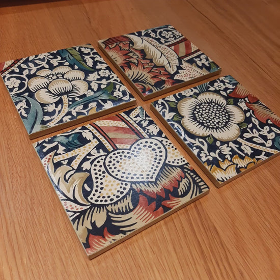 Handmade William Morris Wandle ceramic coasters showing the detailed botanical design and handcrafted finish.