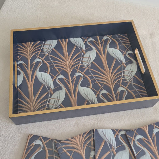 Video of handcrafted navy Nouveau Heron wooden serving tray by The Chateau Angel Strawbridge with metallic bronze edging, and matching coasters available separately.