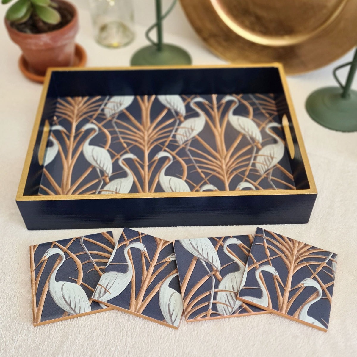 Navy wooden serving tray decorated with Angel Strawbridge Nouveau Heron design and metallic bronze edging, with matching coasters, available separately.