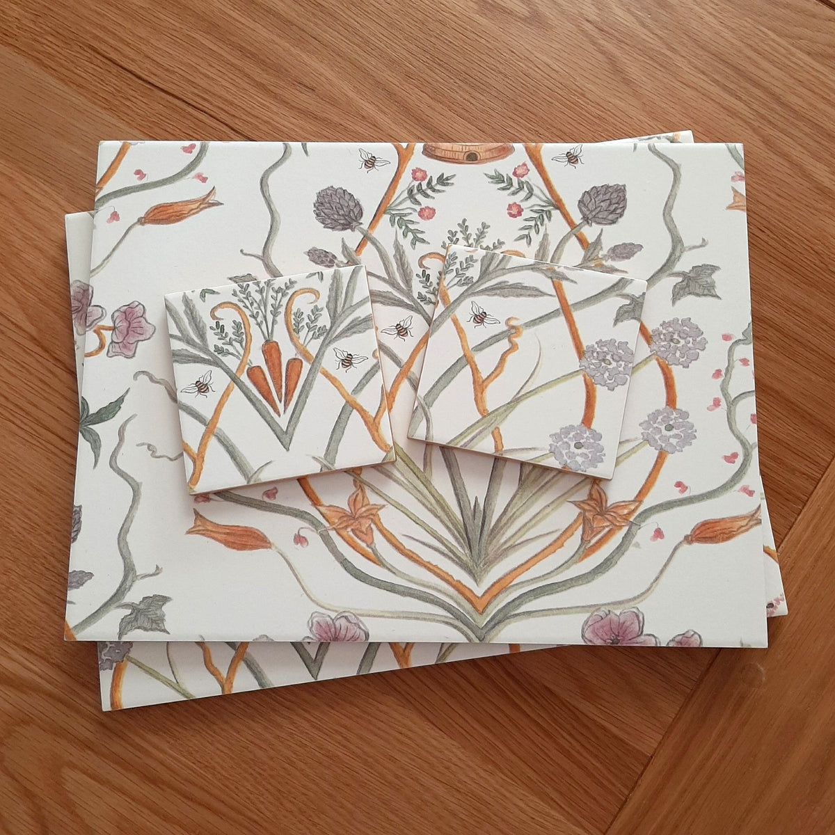 Angel Strawbridge's Chateau Potagerie French garden design on handmade ceramic placemats and matching coasters.