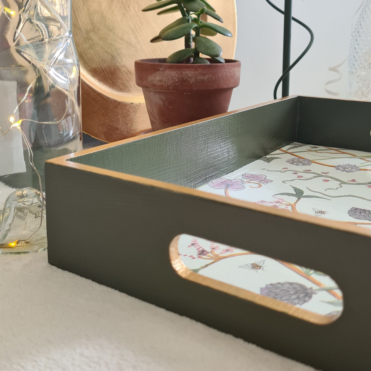 Olive green The Chateau Potagerie wooden serving tray with integrated handles and metallic gold edging.