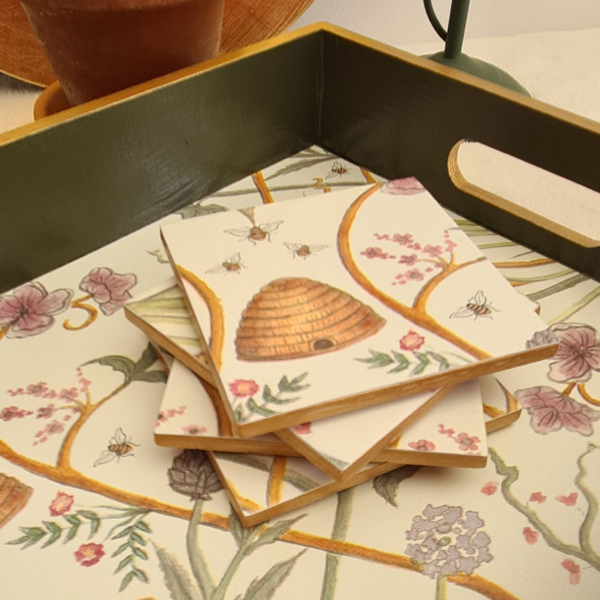 Handcrafted ceramic coasters decorated with The Chateau by Angel Strawbridge Potagerie design with metallic gold edging.  Available separately.