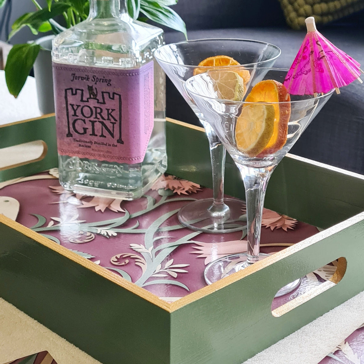 Sage green handcrafted woodland serving tray with integrated handles and metallic gold edging.